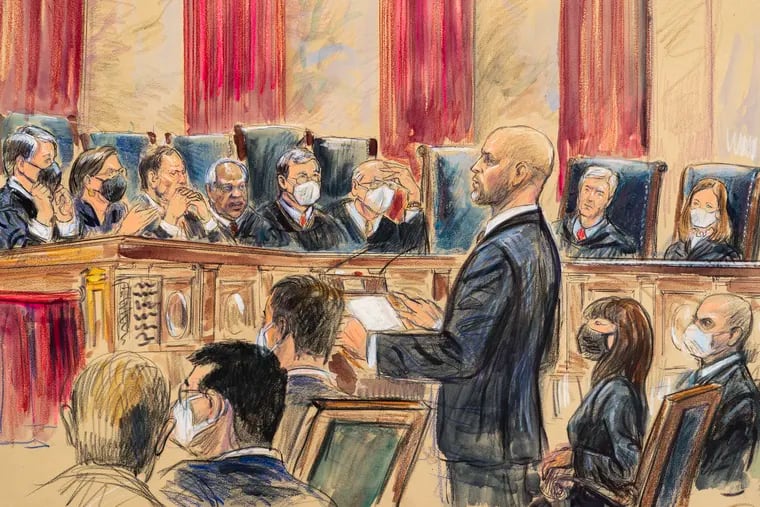 This artist sketch depicts lawyer Scott Keller standing to argue on behalf of more than two dozen business groups seeking an immediate order from the Supreme Court to halt a Biden administration order to impose a vaccine-or-testing requirement on the nation's large employers during the COVID-19 pandemic, at the Supreme Court in Washington.