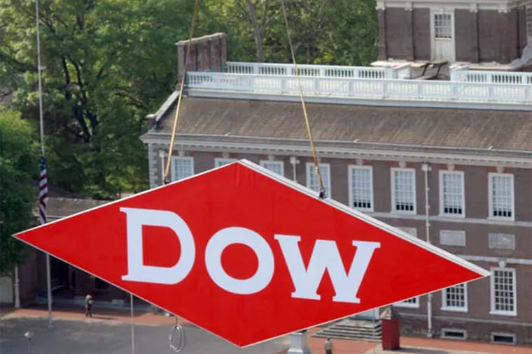 Dow Chemical Co.'s sign stands on the old Rohm & Haas building at Sixth and Market Streets. (April Saul / Staff Photographer)