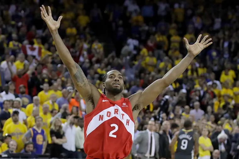 Toronto Raptors forward Kawhi Leonard celebrates after the Raptors defeated the Golden State Warriors in Game 6 of the NBA Finals.