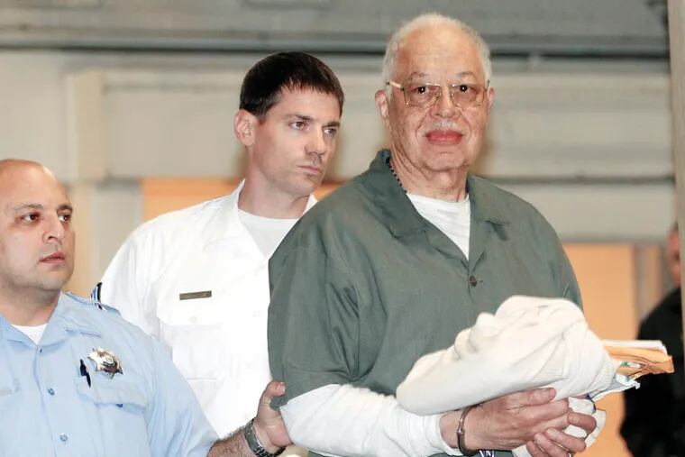 Dr. Kermit Gosnell gets escorted to a van leaving the Criminal Justice Center after getting convicted on three counts of first degree murder on Monday, May 13, 2013.  ( Yong Kim / Staff Photographer )