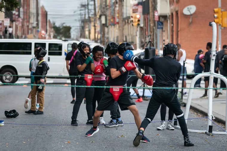 Participants in the boxing program Guns Down Gloves Up, at the 22nd District, in Philadelphia, Friday, October 7, 2022.
