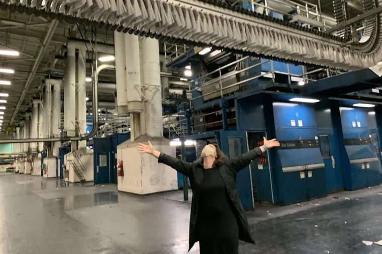 Columnist Maria Panaritis watches the last official press run at the Philadelphia Inquirer's Schuylkill Printing Plant on March 28, 2021.