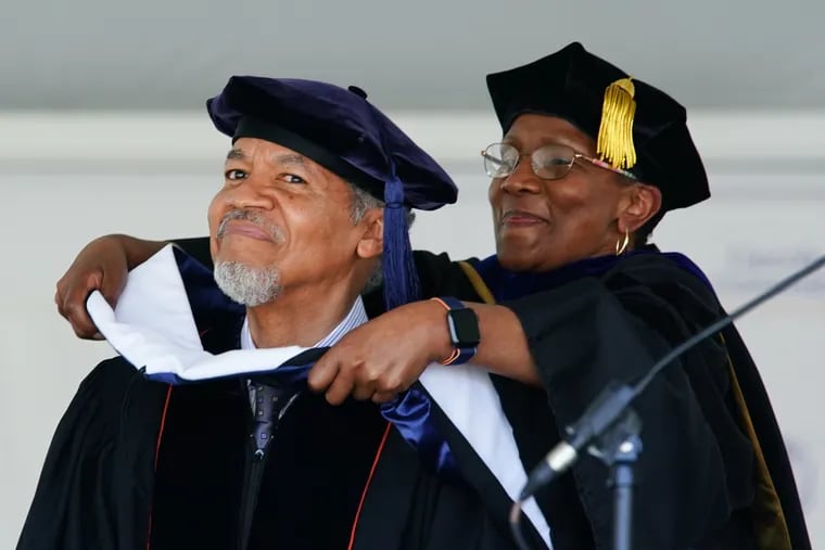 Dean Henry, left, stands in for his father, Nelson Henry Jr., to receive the posthumous honorary Doctor of Humane Letters degree from Lincoln University, from Patricia A. Joseph, Ph.D., Dean of Faculty, right.