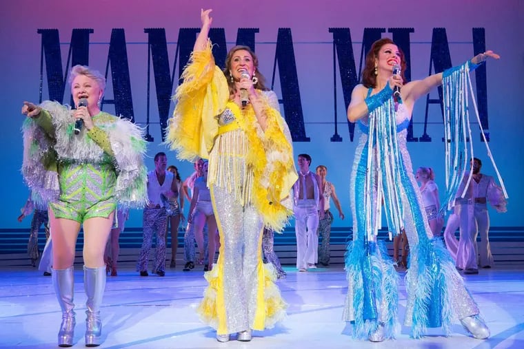 (Left to right:) Charis Leos, Anne Brummel, and Lyn Philistine in “Mamma Mia!,” through July 15 at the Walnut Street Theatre.