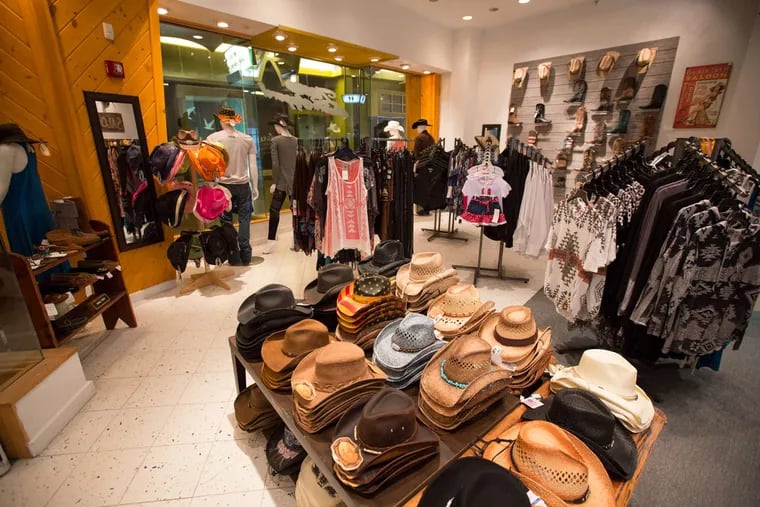 Zane Western Apparel started as a pop-up store but now has a full lease at the Playground. The mall faces many challenges, including slow winter traffic and the resort city's financial problems.