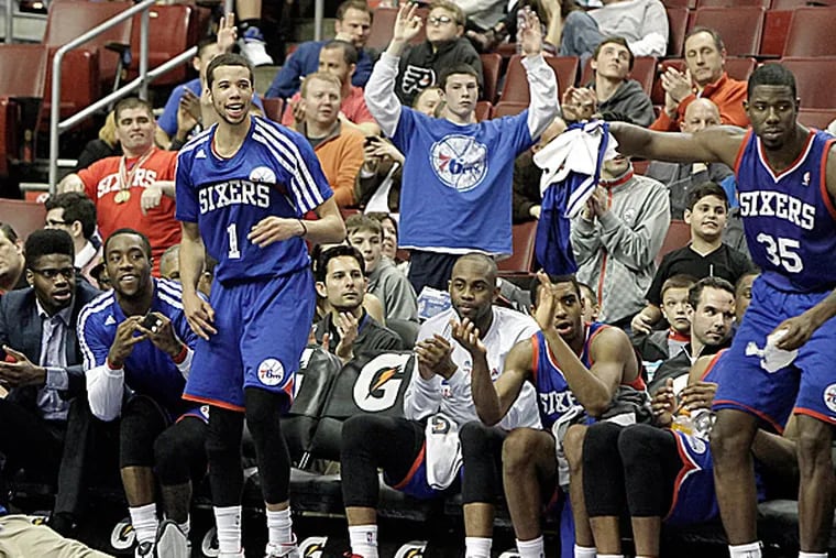 The Sixers bench cheer at the end the game against the Pistons. (Elizabeth Robertson/Staff Photographer)