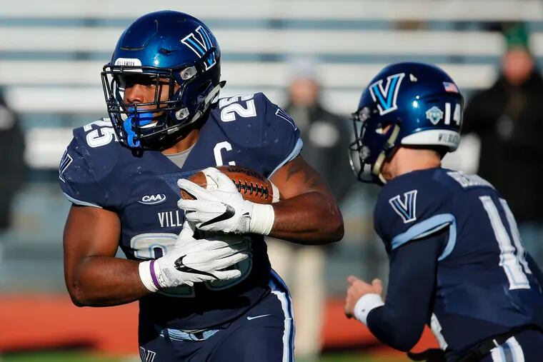 Villanova running back Aaron Forbes looks for running room after taking a handoff from quarterback Zach Bednarczyk during the third quarter of the team's loss to William & Mary earlier this season.