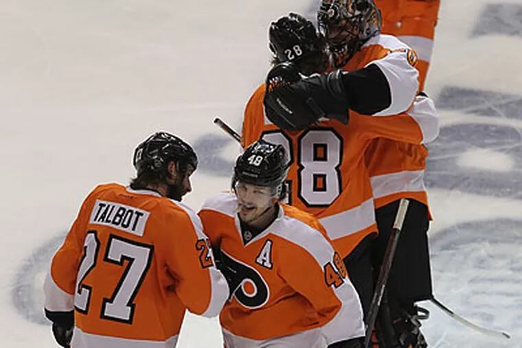Danny Briere (center) has been a leader for the Flyers in this year's playoffs. (Michael Bryant/Staff Photographer)