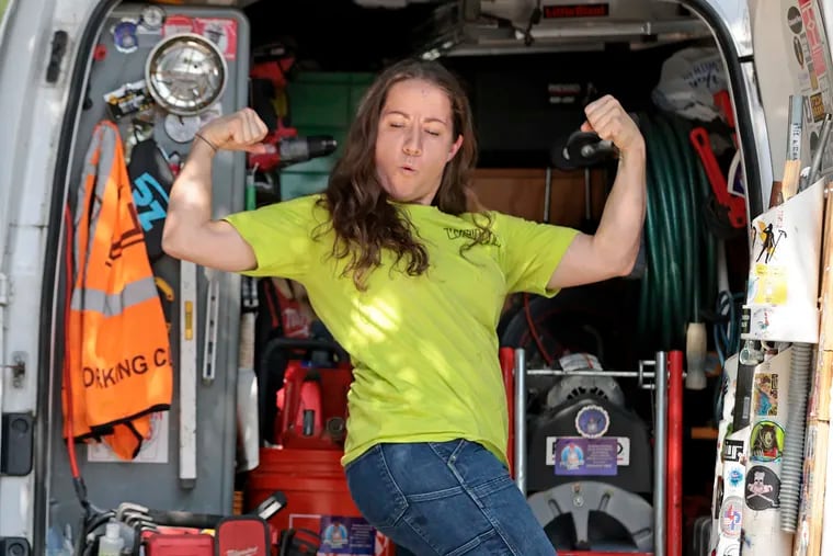 Kelly Ireland, a union plumber whose business is known as the Tiny Plumber Girl, was photographed after lifting a heavy piece of equipment onto her truck in Folsom in July.