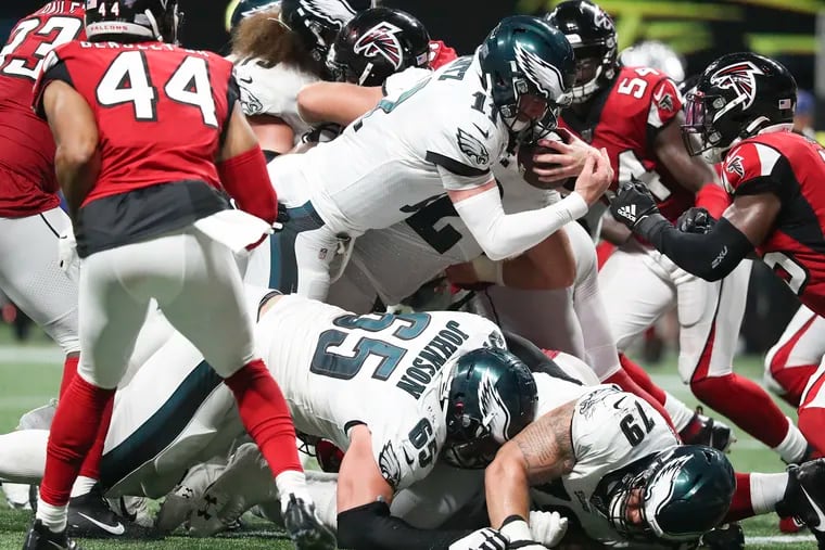 Eagles quarterback Carson Wentz scores a foruth-qarrter touchdown against the Atlanta Falcons Sunday night.