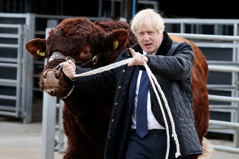 Britain's Prime Minister Boris Johnson visits Darnford Farm in Banchory near Aberdeen, Scotland, Friday Sept. 6, 2019, to coincide with the publication of Lord Bew's review and an announcement of extra funding for Scottish farmers.