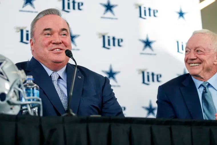 New Cowboys head coach Mike McCarthy, left, is introduced by team owner Jerry Jones. They had expected to reboot the team last week but the coronavirus lockdown has stalled the NFL offseason.