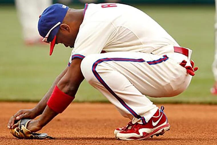 Jimmy Rollins reacts after it was ruled he missed the tag on Elvis Andrus' steal. (Ron Cortes/Staff Photographer)