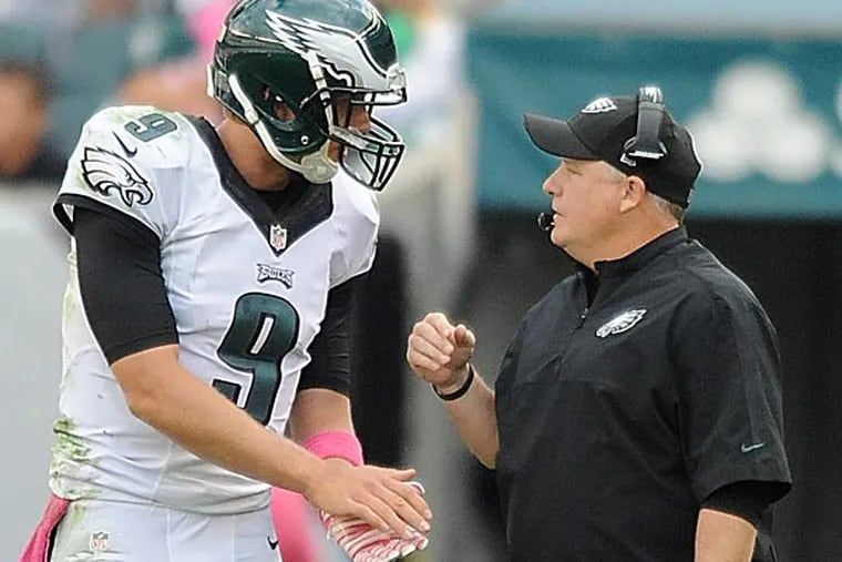 Eagles quarterback Nick Foles and coach Chip Kelly. (Clem Murray/Staff file photo)