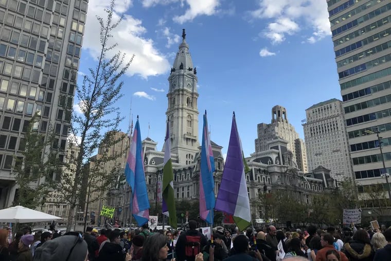 The crowd at the Rally for Trans Existence and Resistance in the shadow of City Hall