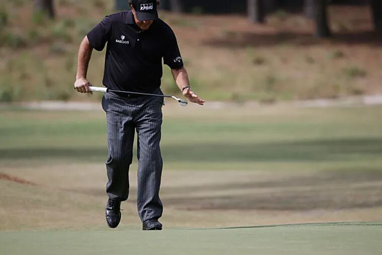 Phil Mickelson misses putt on the 16th hole during the first round of the U.S. Open golf tournament in Pinehurst, N.C., Thursday, June 12, 2014. (David Goldman/AP)