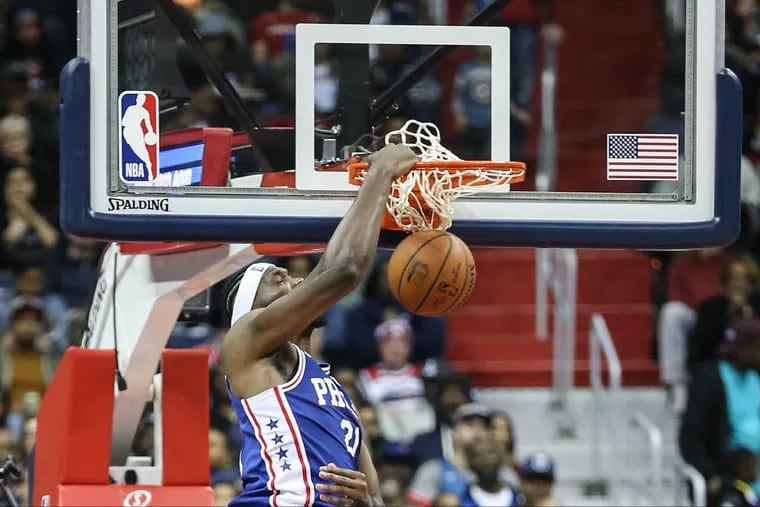 Joel Embiid dunks against the Wizards during the third quarter Wednesday.