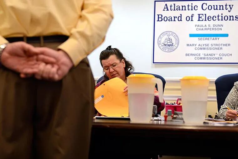 Atlantic County Board of Elections chair Paula Dunn continues recounting mail in ballots in the contested Second District Legislative Race between Democratic challenger Vince Mazzeo and Republican incumbent John Amodeo in a courtroom in Mays Landing December 3, 2013. ( TOM GRALISH / Staff Photographer )