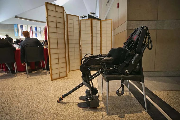 An exoskeleton suit sits in a chair waiting for Sgt. Dan Rose, who was paralyzed while serving in Afghanistan, to demonstrate its use.