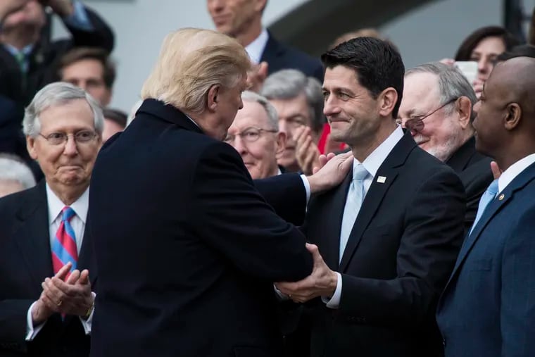 President Donald Trump greets then-House Speaker Paul Ryan (R., Wis.) during a news conference on the South Lawn of the White House in December 2017.