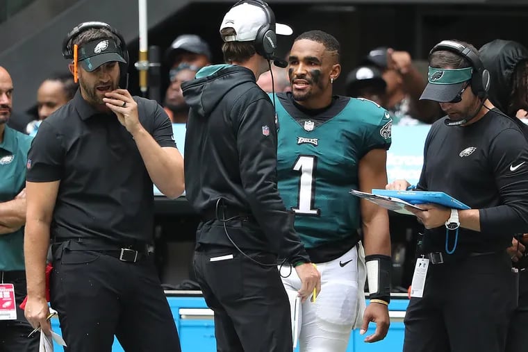 Head coach Nick Sirianni (left) and quarterback Jalen Hurts (1) on the sideline during the Eagles' win over the Falcons in September.