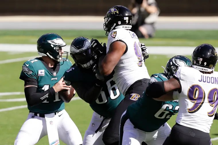Jamon Brown (66) spent much of his Eagles debut at right guard being pushed back into Carson Wentz's lap by Calais Campbell.