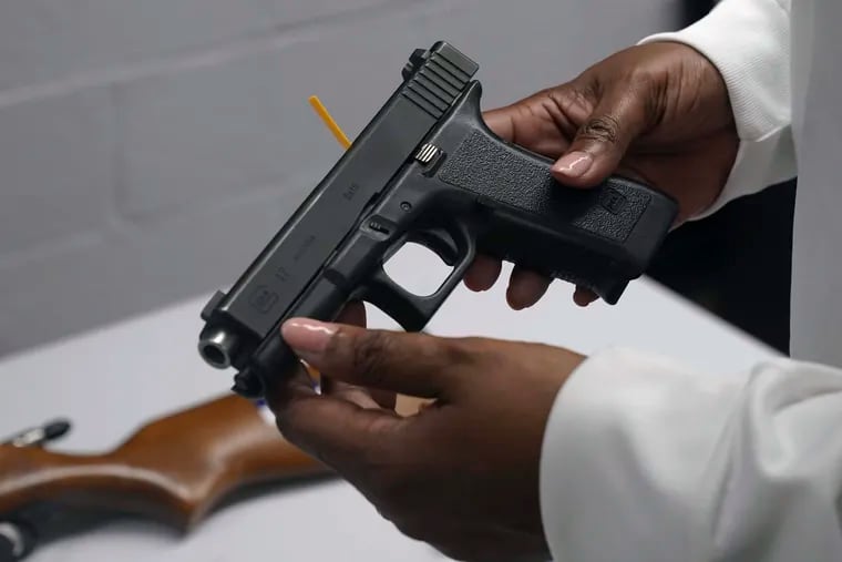 A handgun from a collection of illegal guns being reviewed during a gun buyback event in Brooklyn, N.Y., on May 22, 2021.