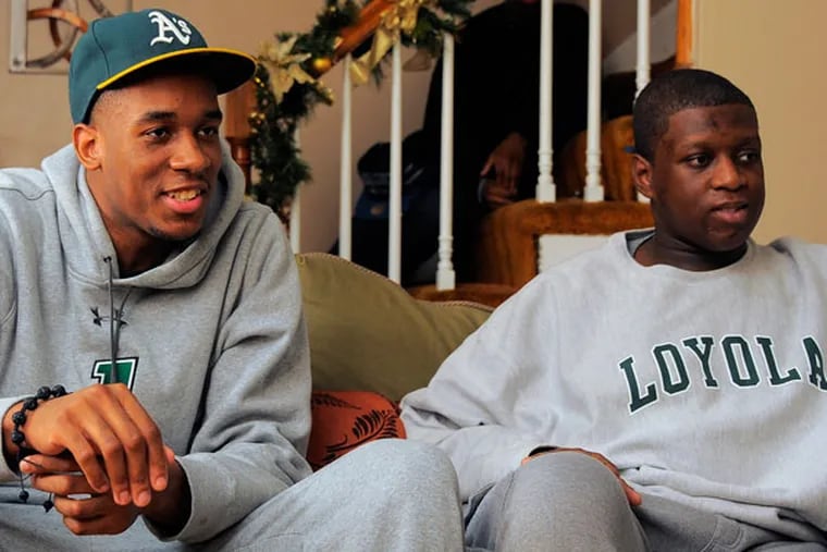 Loyola Greyhounds basketball player Jordan Latham sits with his brother, Myles, who has autism, on Thursday, December 13, 2012, in Baltimore, Maryland. (Karl Merton Ferron/Baltimore Sun/MCT)