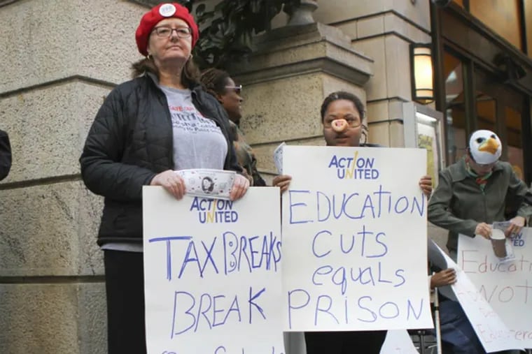 File: Cara Crosby (center), a retired teacher, protests against city tax abatements with the Philadelphia Coalition Advocating for Public Schools outside of 10 Rittenhouse Square in Philadelphia on Tuesday, Oct. 29, 2013. ( Stephanie Aaronson / Philly.com )