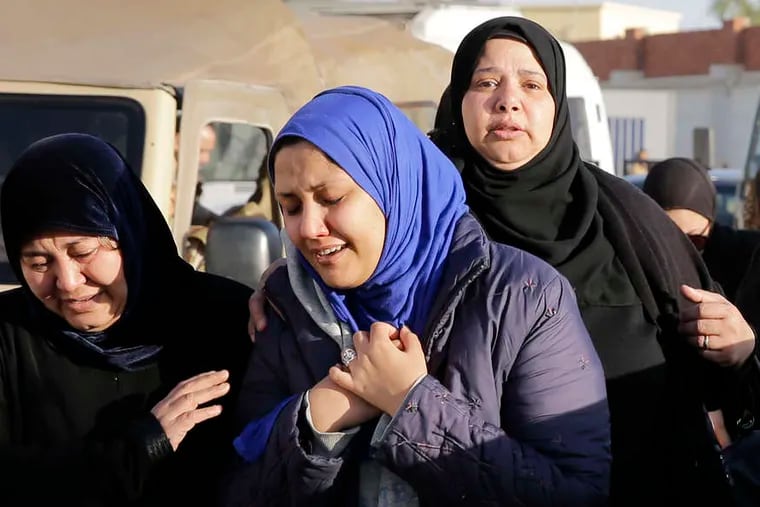 Family members mourn security personnel killed in Sinai on Thursday after receiving their bodies in Cairo.