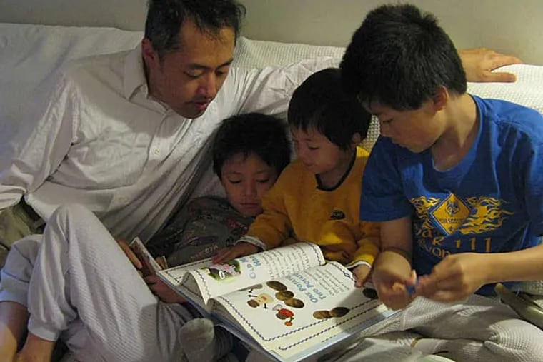 A typical morning in the Chen homeschool: (from left) dad Sterling; Nathanael, 8; Micah, 3; and Isaiah, 11.