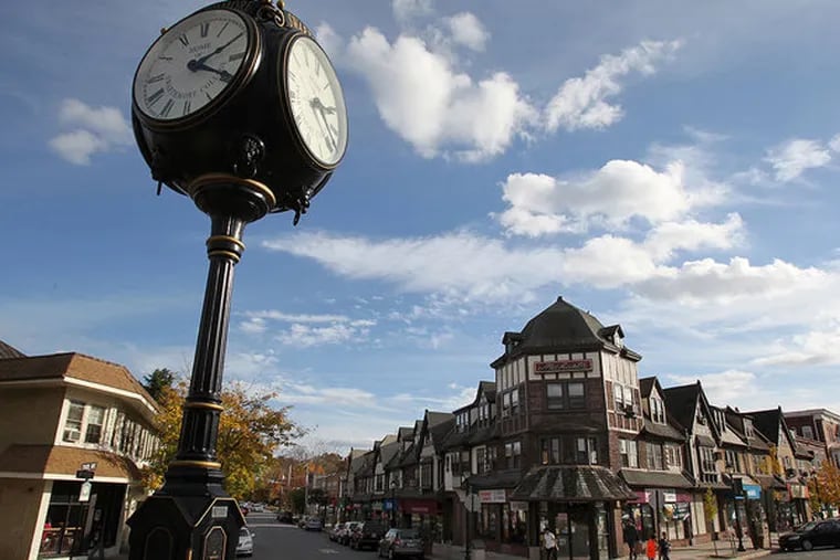 The borough of Swarthmore, home of the college and a quaint town center.  The town center where Chester Rd., right, and Park Ave intersect is shown with the clock at the Swarthmore SEPTA station on Nov. 5, 2013.   ( CHARLES FOX / Staff Photographer )