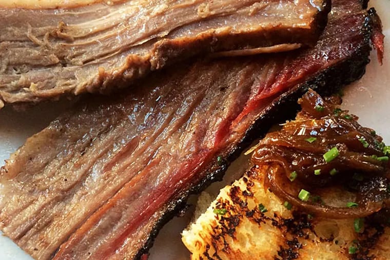 Seriously smoked brisket with grilled potato bread and onion jam from... Percy Street BBQ.