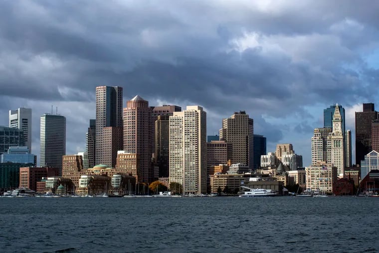 Buildings stand in the city skyline behind the waterfront in Boston.