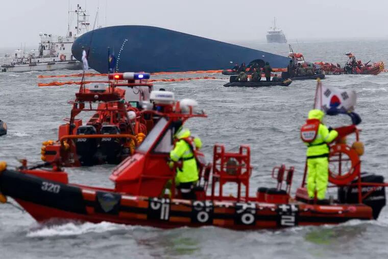 Rescue ships gather near the passenger ship Sawol. Divers worked in shifts to search for the nearly 300 people still missing Thursday.
