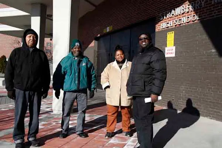 (left to right) James Royal, Tyrone Williams, Tanya Parker, and Donnell Tillery stand outside Strawberry Mansion High School in Philadelphia on January 2, 2013.  ( DAVID MAIALETTI / Staff Photographer )