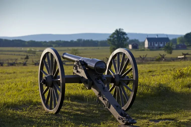 At sunset on the Gettysburg Battlefield, a Union cannon points toward the field where Confederate troops launched Pickett's Charge in July 1863.