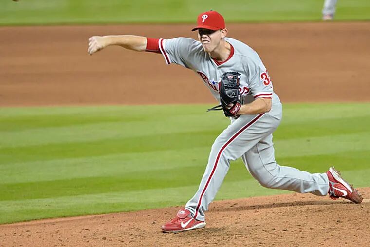 Philadelphia Phillies relief pitcher Justin De Fratus (30) throws the ball against the Miami Marlins during the sixth inning at Marlins Park. (Steve Mitchell/USA Today)