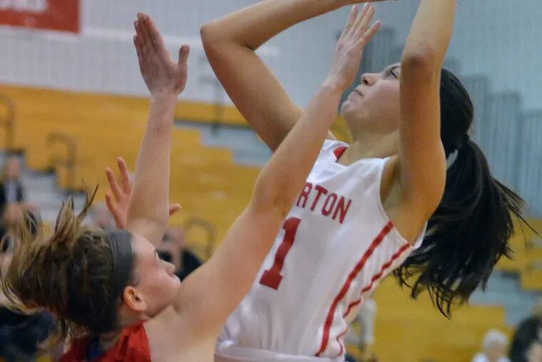Souderton’s Alana Cardona ,11, puts up a shot over Haverford defender Erin Doherty ,25, during second half action in the girls District 1 Class 6A playoff contest at Souderton Area High School on Wednesday February 21,2018. MARK C PSORAS/For the Inquirer