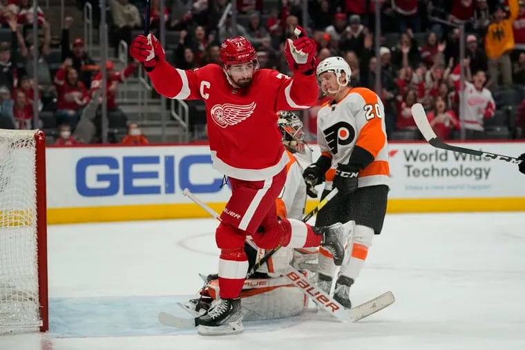 Detroit Red Wings center Dylan Larkin celebrates after Filip Zadina's second-period goal put the Red Wings up 2-0 against the Flyers.