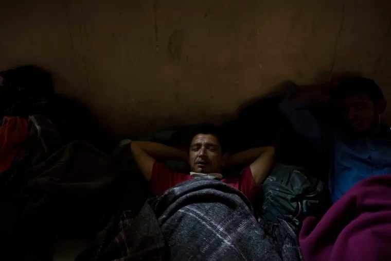 Genaro Fernandez, 33, from Honduras, rests Wednesday in the Migrant Hotel in Mexicali, Mexico.