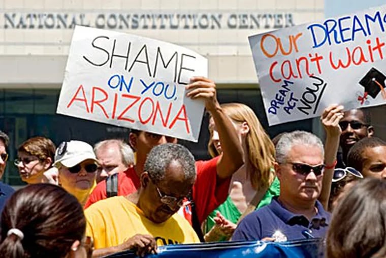 Protestors rallied on Independence Mall today to condemn Arizona's new immigration law and call for immigration reform. (Clem Murray / Staff Photographer)
