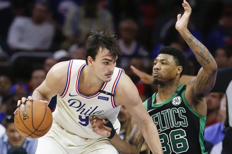 Sixers forward Dario Saric backs down Celtics’ guard Marcus Smart during the Sixers’ Game 3 loss on Monday.