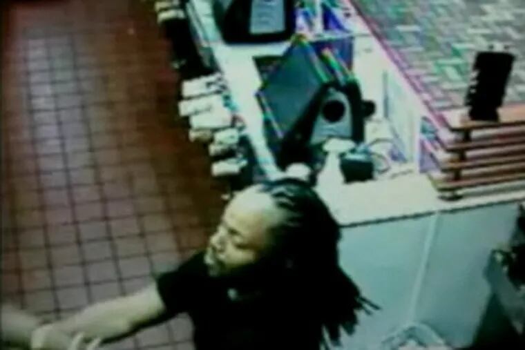 Image from video of suspect who climbed into a New Jersey McDonald's, demanding his Filet-o-Fish.