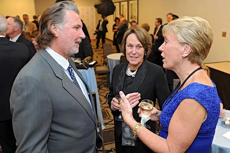 Geoff Petrie (left), who starred at Springfield (Delco) High, Princeton University and the Trailblazers, talks with fellow 2014 inductees into the Philadelphia Sports Hall of Fame Barbara Kelly (center) and Rene Portland of the Immaculatta College "Mighty Macs" reception prior to the induction ceremony dinner. (Clem Murray/Staff Photographer)