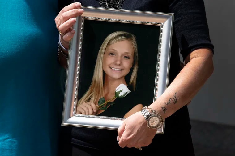Margaret Werstler, holds a portrait of her daughter, Jenny, outside of the federal courthouse in Philadelphia on Wednesday after the sentencing of Emma Semler, one of Jenny's friends who was using heroin with her the night Jenny Werstler suffered a fatal overdose.