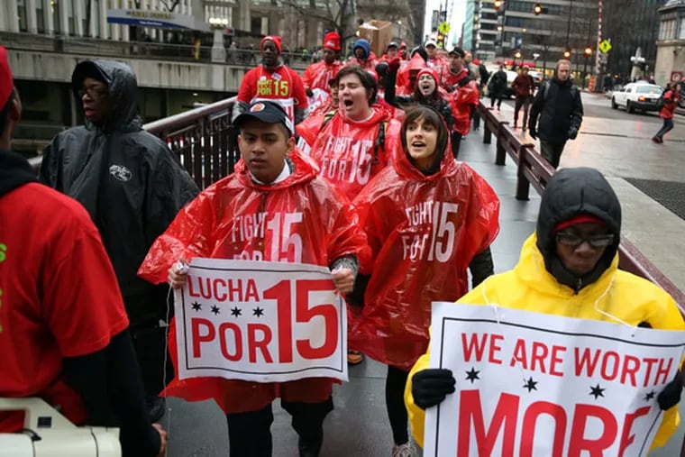 Workers march for the "Fight For 15" rally, organized by the Service Employees International Union along with nonprofit groups, which seeks wages of at least $15 per hour for low-skilled workers, during a protest outside Union Station Wednesday, April 24, 2013, in Chicago, Illinois. (John J. Kim / Chicago Tribune / MCT)