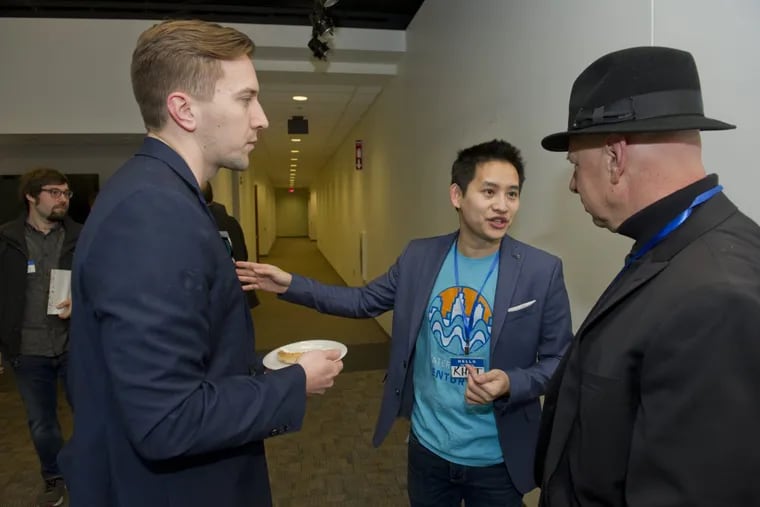 January 14, 2017 — (L to R) Founders of Waterfront Ventures Johnathan Grzybowski and Khai Tran speak with attendee Zave Smith, co-founder of Xhilarate design firm in Philadelphia, during the Up Conference at Waterfront Ventures’ offices in Camden, NJ.  Avi Steinhardt / For the Philadelphia Inquirer