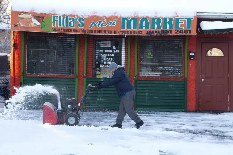 Miguel Santiago, an independent contractor, cleared the parking lot of snow at Fida's Mini Market in Hartford, Conn. Small businesses face a confusing thicket or regulations in hiring contractors and need to follow certain guidelines.