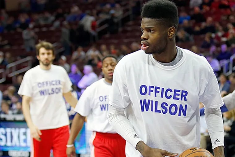 Nerlens Noel and Sixers teammates warm up at Saturday's game wearing T-shirts honoring Wilson. YONG KIM / STAFF PHOTOGRAPHER